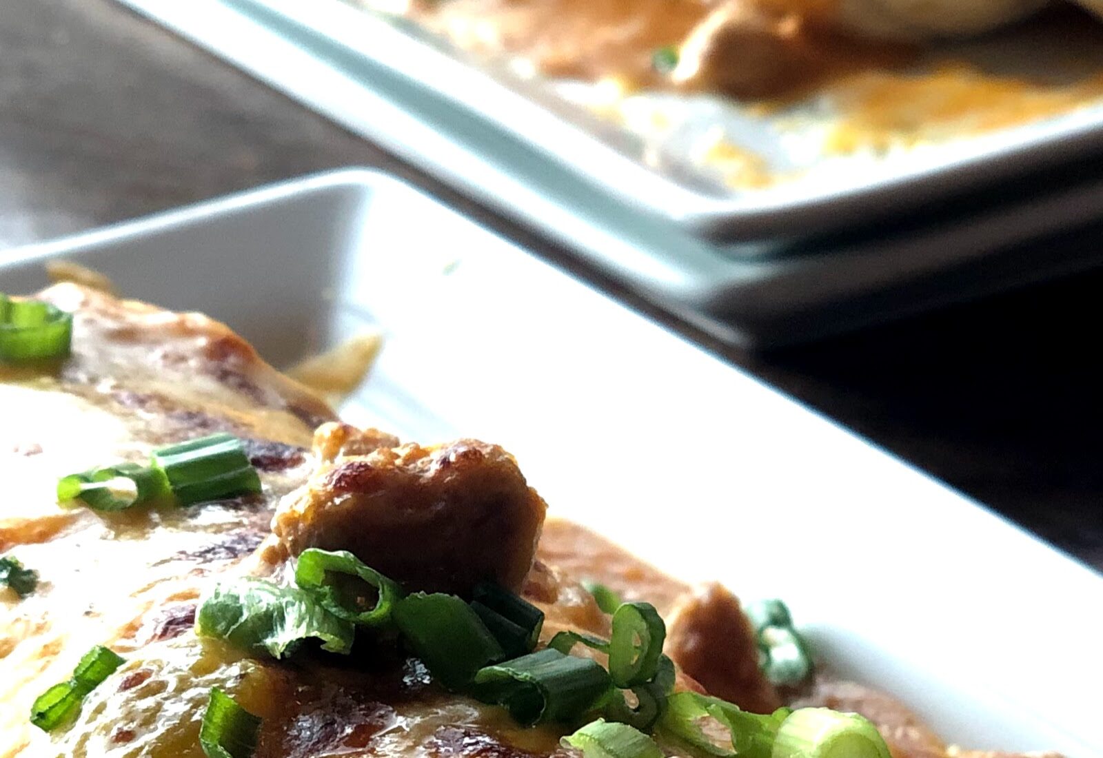 Close-up of breakfast burritos with potatoes, eggs, and cheese